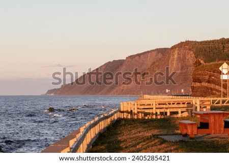 view of the coast on the golden hour with bright light and water