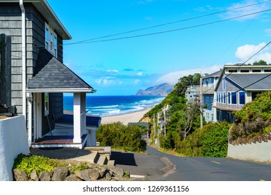 A View Of The Coast Through A Row Of Beach Houses Located In Lincoln City, Oregon.