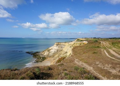 View of coastline in southern England. Scenic view from on top cliff looking out to sea. Hampshire coastline with eroded cliff on beach - Shutterstock ID 2188968555