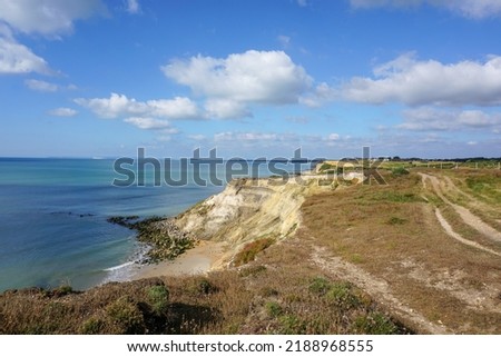 View of coastline in southern England. Scenic view from on top cliff looking out to sea. Hampshire coastline with eroded cliff on beach