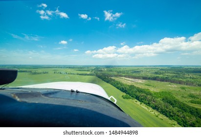 View from the cockpit of a light plane while approaching the runway during the landing