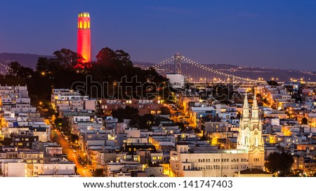 View of Coit Tower and St. Peter and Paul church at night, from Lombard street.
