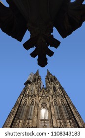 View of Cologne Cathedral in Germany and a replicate of the finial of the top of one of the spires, wide angle view from below