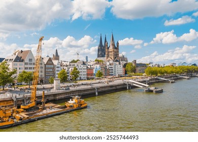 view of Cologne Cathedral and the Hohenzollern Bridge. The Gothic architecture of the cathedral contrasts beautifully with the iconic steel structure of the bridge. - Powered by Shutterstock