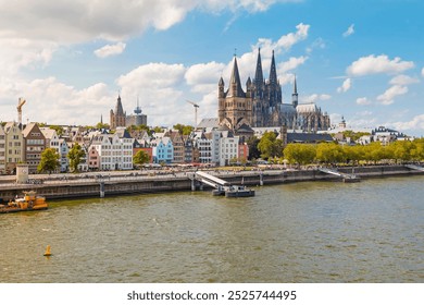 view of Cologne Cathedral and the Hohenzollern Bridge. The Gothic architecture of the cathedral contrasts beautifully with the iconic steel structure of the bridge. - Powered by Shutterstock