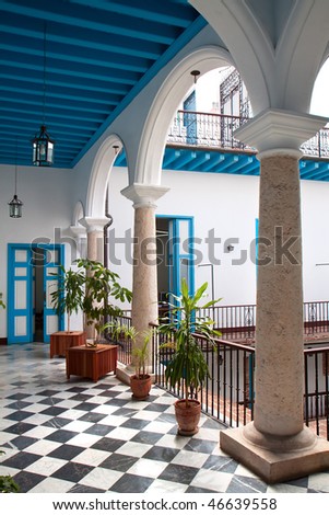  A view of colonial building interior with tropical flowers, Old Havana , Cuba