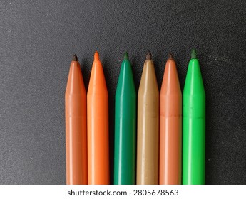 Close‑Up View of Colored Marker Tips in Neat Row