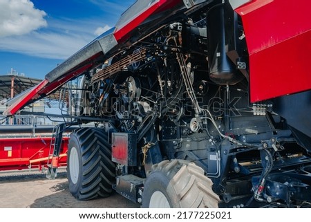 A view of the combine's motor. Big powerful industrial combine harvester machine. Engine details. Diesel engine. Motor. Heart of the tractor. Oil machinery technology 