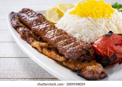 A view of combo filet mignon steak and beef soltani kabob, with saffron basmati rice.