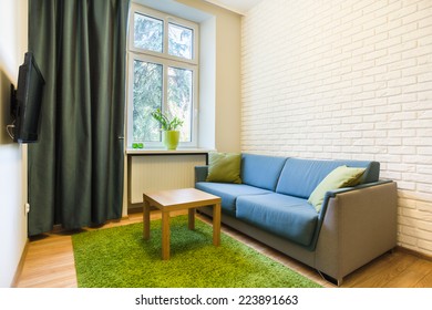 View of comfortable couch in small flat