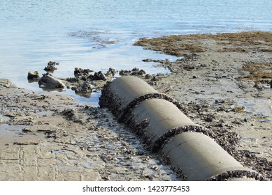 View Of Concrete Stormwater Pipe Discharge Into Ocean