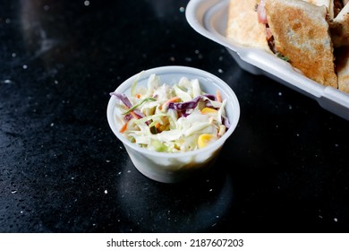 A View Of A Condiment Cup Of Coleslaw.