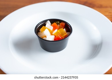 A View Of A Condiment Cup Of Rainbow Jelly.