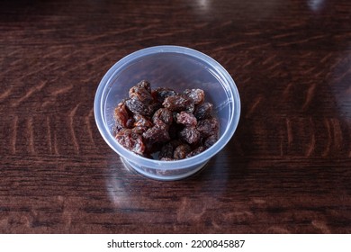 A View Of A Condiment Cup Of Raisins.