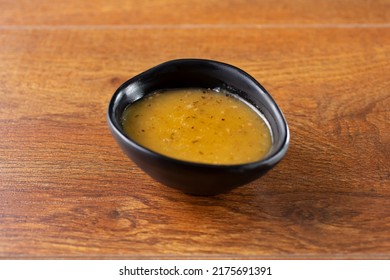 A View Of A Condiment Cup Of Salad Dressing.