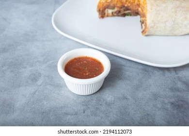 A View Of A Condiment Cup Of Salsa.