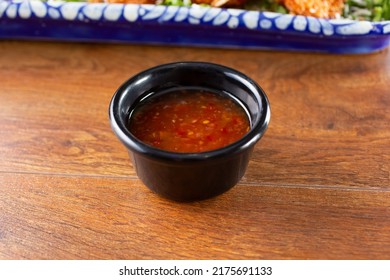 A View Of A Condiment Cup Of Sweet Chili Sauce.