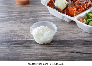 A View Of A Condiment Cup Of Toum.