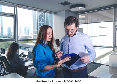 View From A Conservative Office, Director Man Signing The Documents That Offered From A Woman Employee