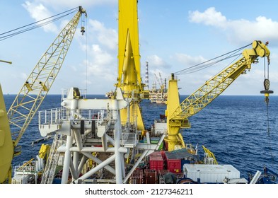 A view of a construction pipeplay work barge deck while in operation at offshore oil field