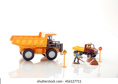 View Of Construction Site Of Mini Toy Worker On White Background.