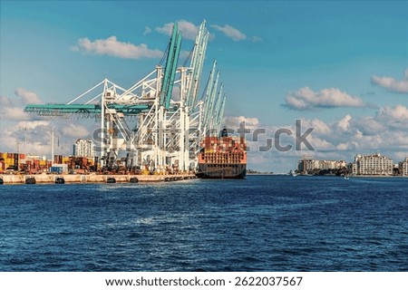 A view of a container ship offloading at the South Florida Container Terminal in Miami in springtime