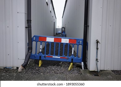 View Of A Cordoned Off Alley Way On An Industrial Complex