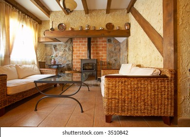 View of a cozy old living room with fireplace