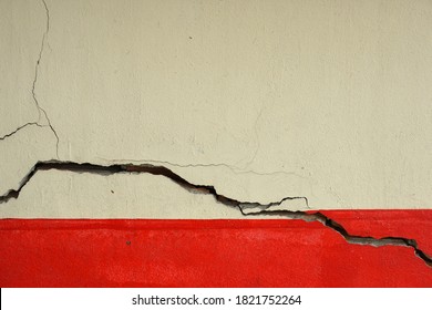 View of the cracked lower house plaster wall  From earthquakes