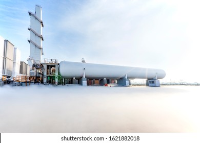 View Of The Cylindrical, Horizontal Nitrogen And Oxygen Storage Tank In The Industrial Plant. 