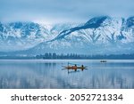 A view of Dal Lake in winter, and the beautiful mountain range in the background in the city of Srinagar, Kashmir, India.