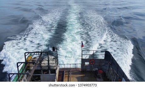 View Of The Deck Of A Fishing Trawler And The Wake Of The Sea.