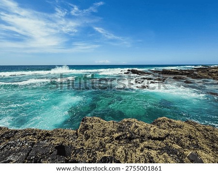 View of a deep blue ocean on a shoreline 