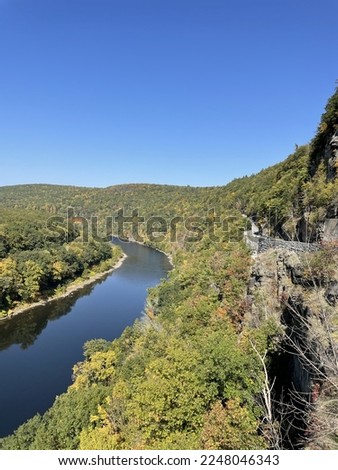 The view of the Delaware River from the beautiful Hawk's Nest overlook in New York. The winding road that runs along the cliff is visible.