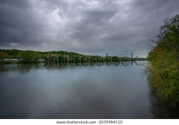 View of the Delaware River\
dividing Pennsylvania and New Jersey on a cloudy Day - Copy\
Space