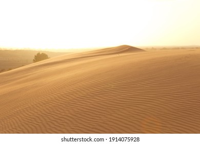 A view of desert dunes at sunset. Beautiful sand dunes in the Sahara desert at Morocco