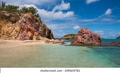 View of a deserted tropical beach on The Five Islands off Antigua in The Leeward Islands, West Indies.