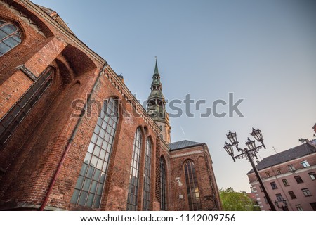 view of detail of Saint Peter Lutheran Church on the Old Town in Riga against blue sky background