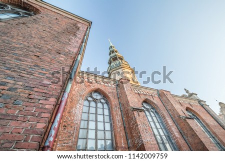 view of detail of Saint Peter Lutheran Church on the Old Town in Riga against blue sky background