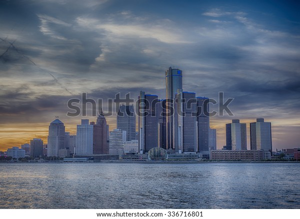 A view of Detroit skyline at sunset with dramatic\
HDR effect