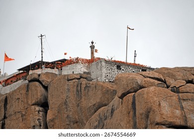 View of devotees lining up to visit Hanuman Temple on Anjanadri Hill at Hampi, Karnataka, India