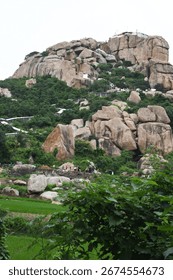 View of devotees lining up to visit Hanuman Temple on Anjanadri Hill at Hampi, Karnataka, India