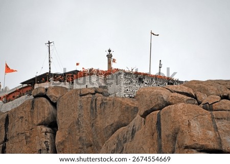 View of devotees lining up to visit Hanuman Temple on Anjanadri Hill at Hampi, Karnataka, India