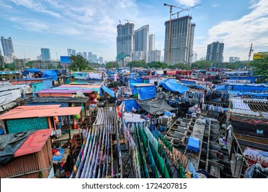 View of Dhobi Ghat (Mahalaxmi Dhobi Ghat) is world largest open air laundromat (lavoir) in Mumbai, India with laundry drying on ropes. Now one of signature landmarks and tourist attractions of Mumbai - Shutterstock ID 1724207815