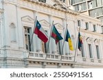 View of different Chilean and Mapuche flags waving in a museum in the main square of Santiago de Chile. On a sunny day