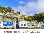 View of directional and warning signs in the fishing village Polperro, Cornwall, England, UK