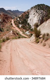 View Of Dirt Road Leading Through Tough Desert Terrain. Cottonwood Canyon Road, Utah, USA.