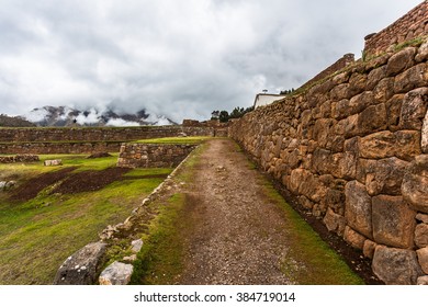 View Of A Dirt Track Along The Stone Wall Of Large Stones Of Different Sizes In The District Of Chinchero, Peru