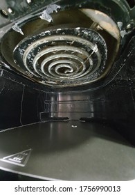 a view of dirty air fryer interior waiting on cleaning progress.