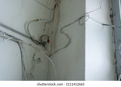 View Of Dirty Electrical Cables, Tangled Electrical Wires Inside The Building